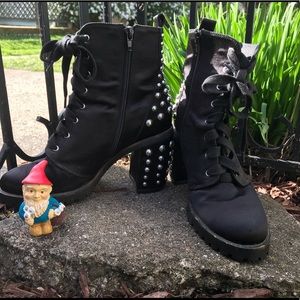 Black studded ankle combat boots.